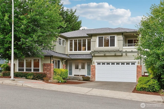 3301 Monterey Ct NE, Renton, WA 98056 - view of front facade featuring brick siding, concrete driveway, a garage, and roof with shingles