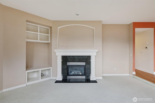 3301 Monterey Ct NE, Renton, WA 98056 - unfurnished living room with carpet, a fireplace, and built in shelves