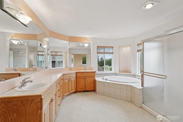 3301 Monterey Ct NE, Renton, WA 98056 - bathroom with healthy amount of natural light, double vanity, a shower stall, and a bath