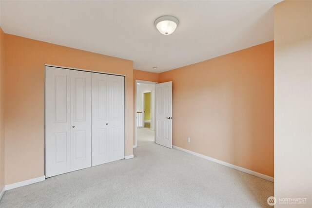 3301 Monterey Ct NE, Renton, WA 98056 - unfurnished bedroom featuring carpet flooring and a closet