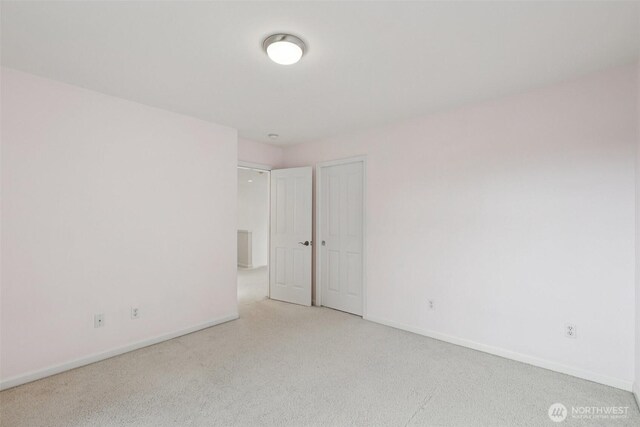 3301 Monterey Ct NE, Renton, WA 98056 - unfurnished room featuring light colored carpet and baseboards