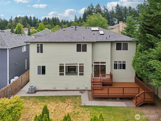 3301 Monterey Ct NE, Renton, WA 98056 - back of house with a fenced backyard, a patio, a wooden deck, and roof with shingles
