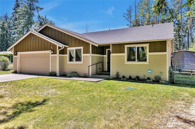 19802 69th Avenue Ct E, Spanaway, WA 98387 - view of front of home featuring board and batten siding, a shingled roof, driveway, and a garage