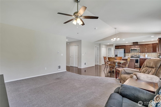 19802 69th Avenue Ct E, Spanaway, WA 98387 - living area featuring vaulted ceiling, a chandelier, a ceiling fan, dark carpet, and recessed lighting