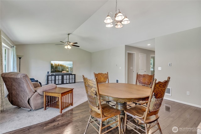 19802 69th Avenue Ct E, Spanaway, WA 98387 - dining area with wood finished floors, a chandelier, lofted ceiling, a ceiling fan, and healthy amount of natural light