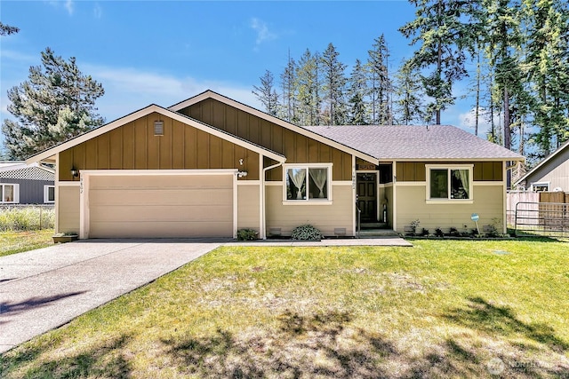 19802 69th Avenue Ct E, Spanaway, WA 98387 - view of front of home with an attached garage, board and batten siding, driveway, and roof with shingles