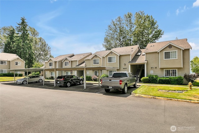 1835 S 286th Ln Unit R201, Federal Way, WA 98003 - multi unit property featuring covered and uncovered parking and a residential view