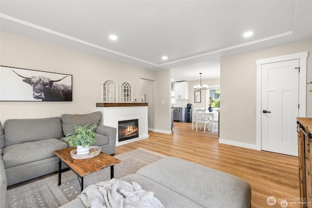 5116 N 40th St, Tacoma, WA 98407 - living area featuring light wood-style flooring, recessed lighting, a glass covered fireplace, and a chandelier