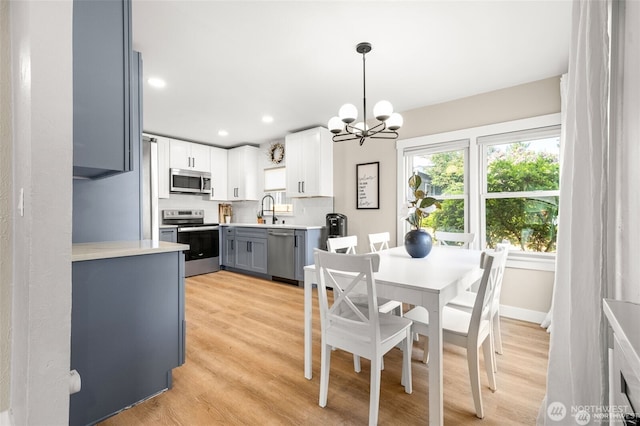 5116 N 40th St, Tacoma, WA 98407 - dining room featuring a chandelier, light wood-style floors, and recessed lighting