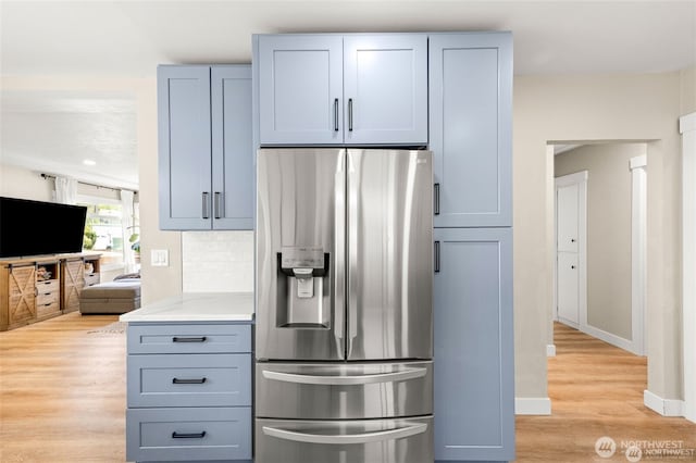 5116 N 40th St, Tacoma, WA 98407 - kitchen featuring stainless steel refrigerator with ice dispenser, light wood finished floors, light countertops, backsplash, and gray cabinets