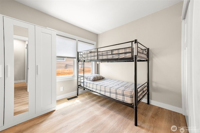 5116 N 40th St, Tacoma, WA 98407 - bedroom with light wood-style floors and baseboards