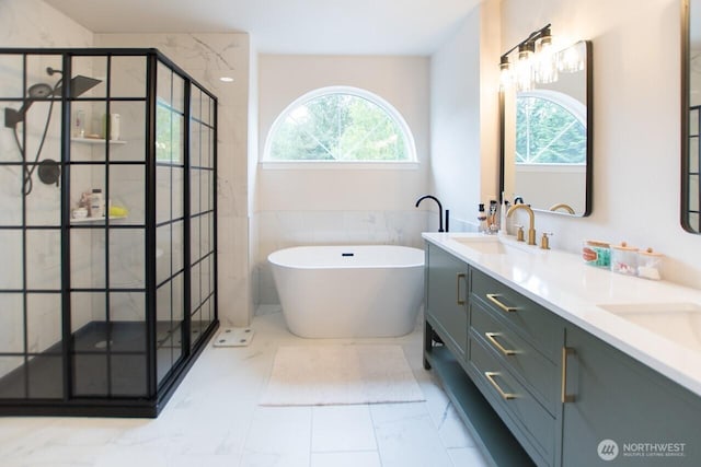 903 198th Ave E, Lake Tapps, WA 98391 - full bath with healthy amount of natural light, double vanity, a shower stall, a soaking tub, and tile walls