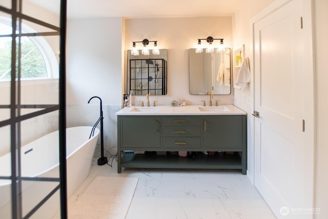 903 198th Ave E, Lake Tapps, WA 98391 - bathroom featuring a freestanding tub, double vanity, and marble look tile flooring