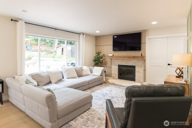 903 198th Ave E, Lake Tapps, WA 98391 - living area featuring a stone fireplace, light wood-style flooring, and recessed lighting