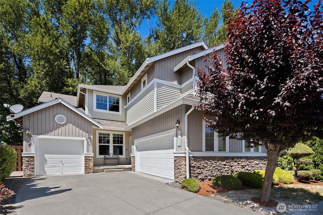 21609 46th Pl S Unit 95, Kent, WA 98032 - view of front of house featuring stone siding, an attached garage, concrete driveway, and roof with shingles