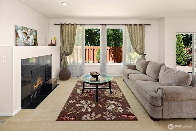 21609 46th Pl S Unit 95, Kent, WA 98032 - carpeted living room featuring a tile fireplace and plenty of natural light