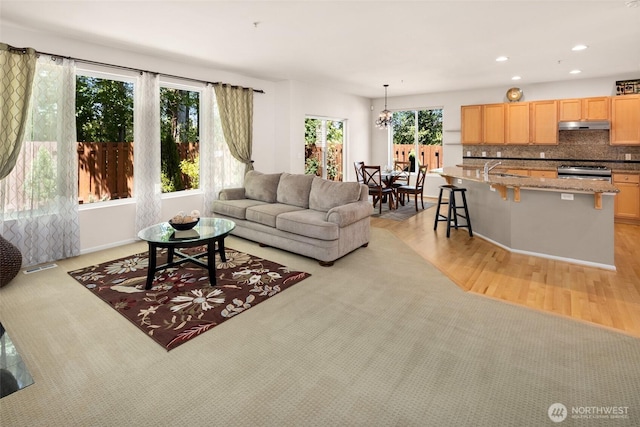 21609 46th Pl S Unit 95, Kent, WA 98032 - living area featuring light wood-style flooring, recessed lighting, and a chandelier