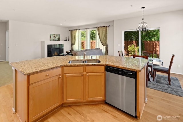 21609 46th Pl S Unit 95, Kent, WA 98032 - kitchen featuring stainless steel dishwasher, open floor plan, light wood-type flooring, and light stone counters