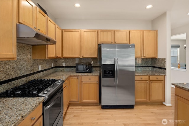 21609 46th Pl S Unit 95, Kent, WA 98032 - kitchen with appliances with stainless steel finishes, under cabinet range hood, light wood-style flooring, stone countertops, and recessed lighting