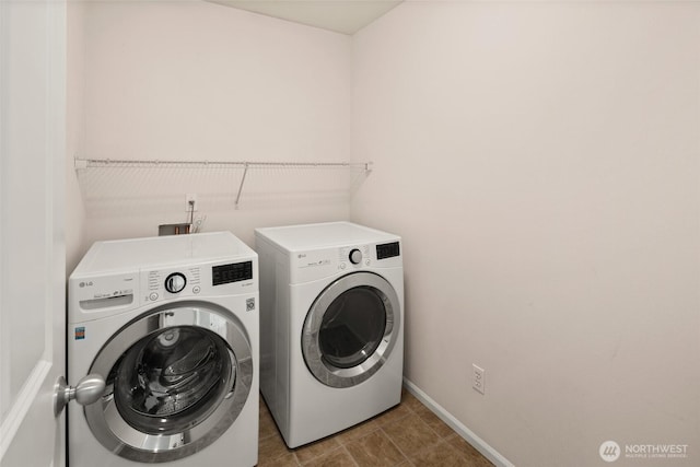 21609 46th Pl S Unit 95, Kent, WA 98032 - washroom featuring washer and dryer and baseboards