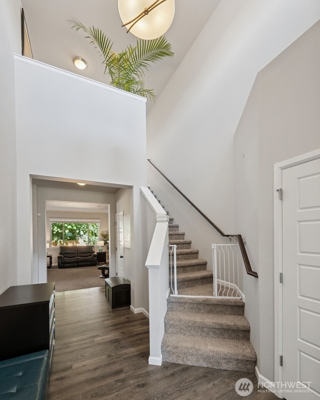 20122 18th Avenue Ct E, Spanaway, WA 98387 - staircase featuring wood finished floors and a high ceiling