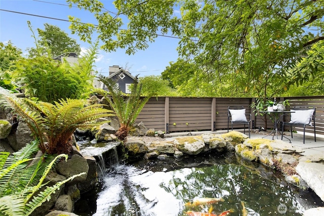 201 20th Ave E, Seattle, WA 98112 - view of yard featuring a small pond and a patio