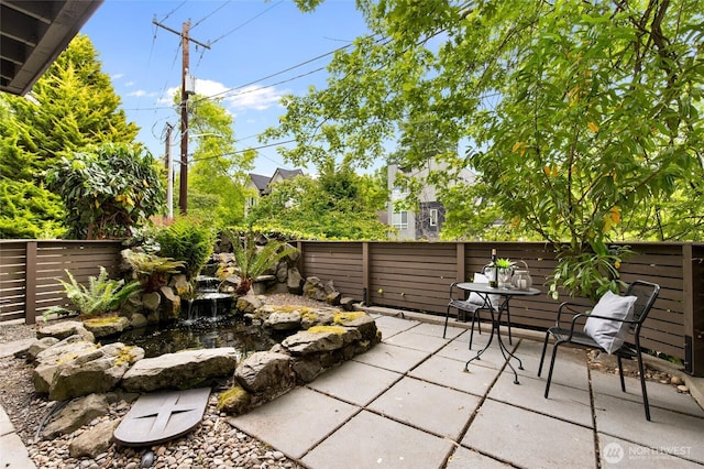 201 20th Ave E, Seattle, WA 98112 - fenced backyard featuring a patio