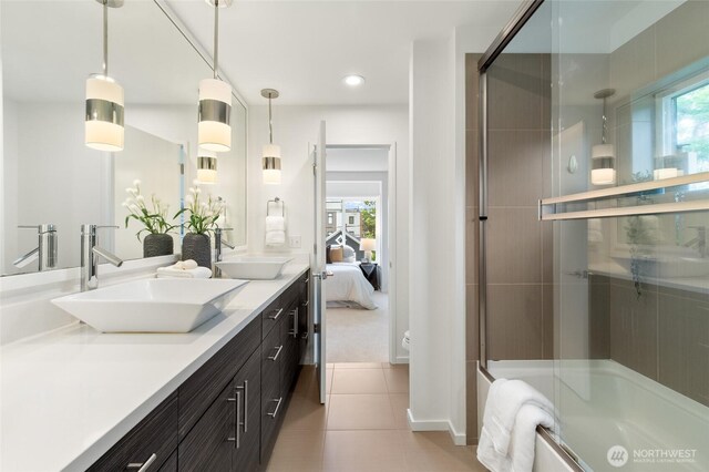 201 20th Ave E, Seattle, WA 98112 - bathroom with double vanity, bath / shower combo with glass door, tile patterned floors, plenty of natural light, and recessed lighting
