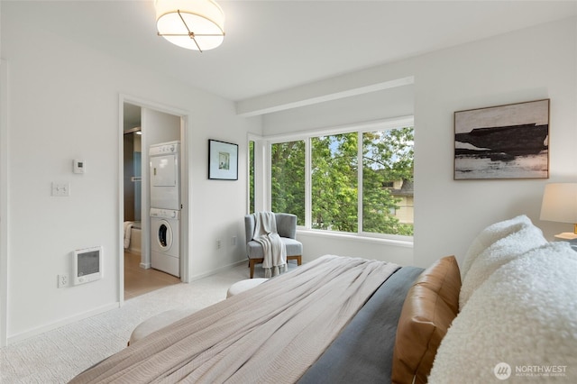 201 20th Ave E, Seattle, WA 98112 - bedroom with stacked washer / drying machine, light carpet, and heating unit