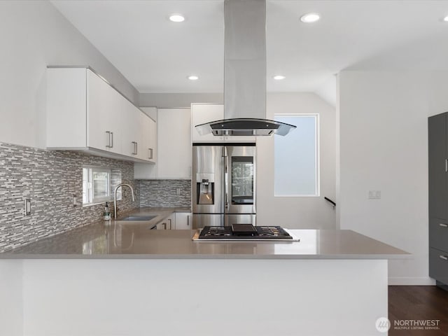 733 Martin Luther King Jr Way, Seattle, WA 98144 - kitchen with stainless steel fridge, island exhaust hood, gas cooktop, a peninsula, and tasteful backsplash