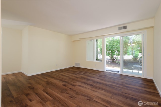 5029 84th St SW Unit 301, Mukilteo, WA 98275 - spare room featuring dark wood-style flooring and baseboards