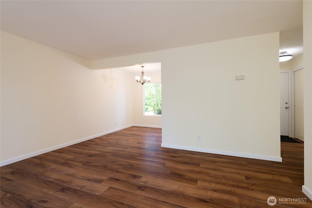 5029 84th St SW Unit 301, Mukilteo, WA 98275 - empty room featuring a chandelier and dark wood-type flooring
