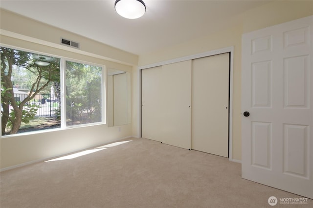5029 84th St SW Unit 301, Mukilteo, WA 98275 - unfurnished bedroom featuring light carpet and a closet