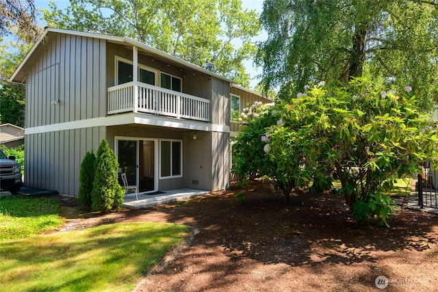 5029 84th St SW Unit 301, Mukilteo, WA 98275 - rear view of house with a balcony and board and batten siding