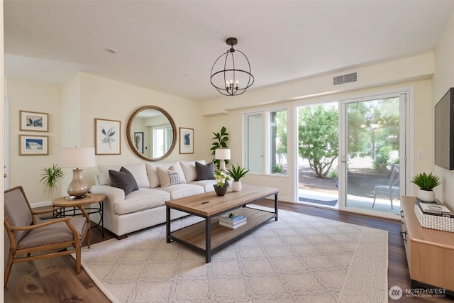 5029 84th St SW Unit 301, Mukilteo, WA 98275 - living area featuring light wood-style floors and a chandelier