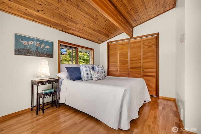 9882 Manitou Beach Dr NE, Bainbridge Island, WA 98110 - bedroom with wooden ceiling, wood finished floors, and a closet