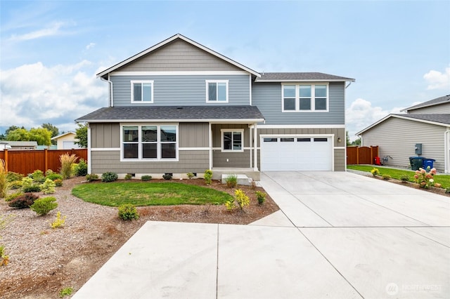128 N Trail Rd, Sedro Woolley, WA 98284 - traditional-style home featuring driveway, a garage, roof with shingles, and board and batten siding