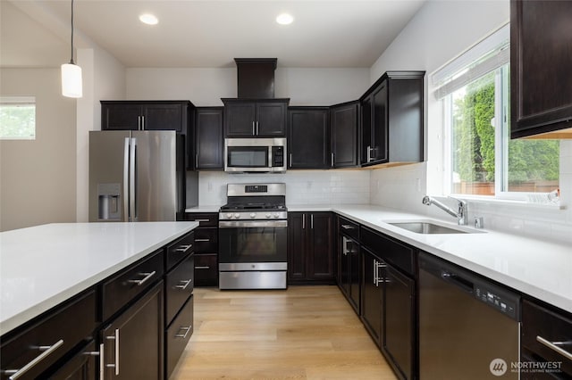 128 N Trail Rd, Sedro Woolley, WA 98284 - kitchen featuring appliances with stainless steel finishes, healthy amount of natural light, light countertops, light wood finished floors, and recessed lighting