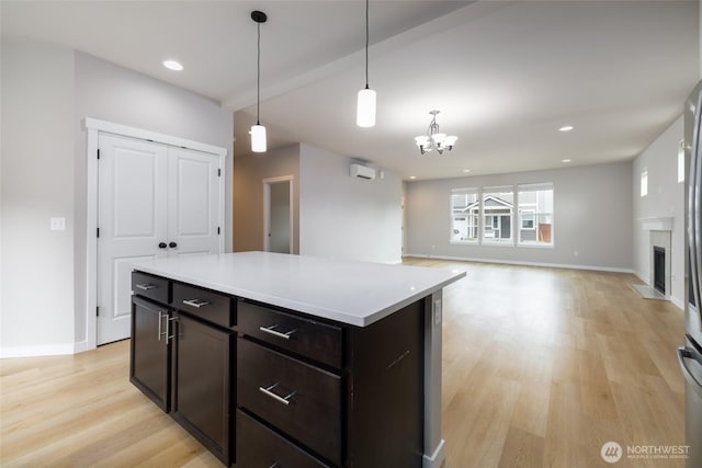 128 N Trail Rd, Sedro Woolley, WA 98284 - kitchen with light wood-style flooring, a chandelier, light countertops, decorative light fixtures, and recessed lighting