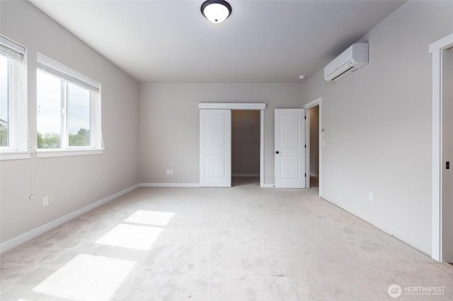 128 N Trail Rd, Sedro Woolley, WA 98284 - unfurnished bedroom with an AC wall unit, light colored carpet, and a closet