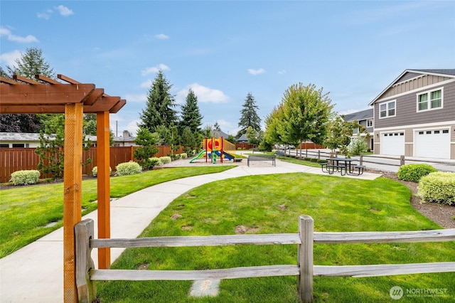 128 N Trail Rd, Sedro Woolley, WA 98284 - view of yard with a playground, a pergola, and a garage