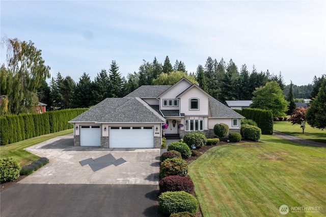 677 Schultz Dr, Bellingham, WA 98226 - traditional-style home featuring concrete driveway, a garage, a front lawn, stone siding, and a shingled roof