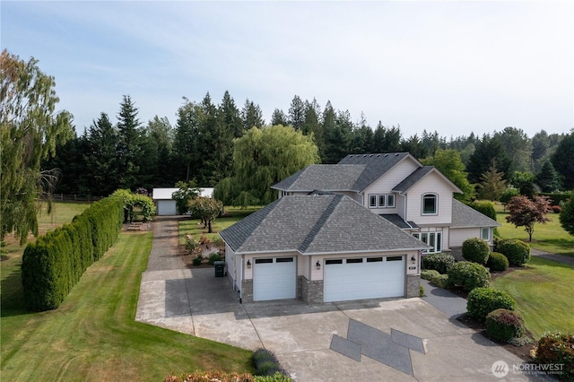 677 Schultz Dr, Bellingham, WA 98226 - traditional-style home featuring a garage, a front lawn, concrete driveway, and roof with shingles