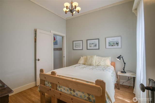 604 Ocean Shores Blvd SW, Ocean Shores, WA 98569 - bedroom with a chandelier and light wood-type flooring