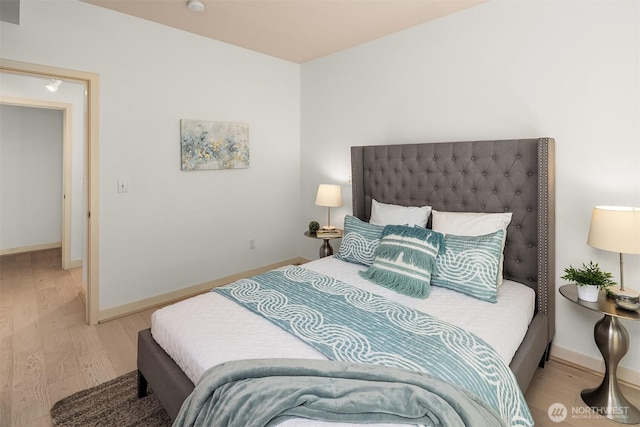 300 110th Ave NE Unit 303, Bellevue, WA 98004 - bedroom with light wood-style flooring and baseboards