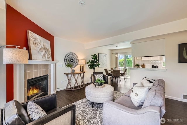 17201 127th Pl NE Unit 101, Woodinville, WA 98072 - living room with wood finished floors and a tile fireplace