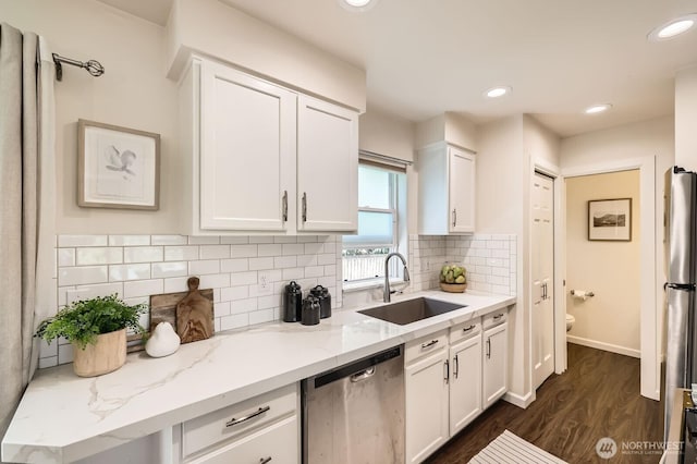 17201 127th Pl NE Unit 101, Woodinville, WA 98072 - kitchen with appliances with stainless steel finishes, white cabinetry, dark wood-style flooring, light stone countertops, and recessed lighting