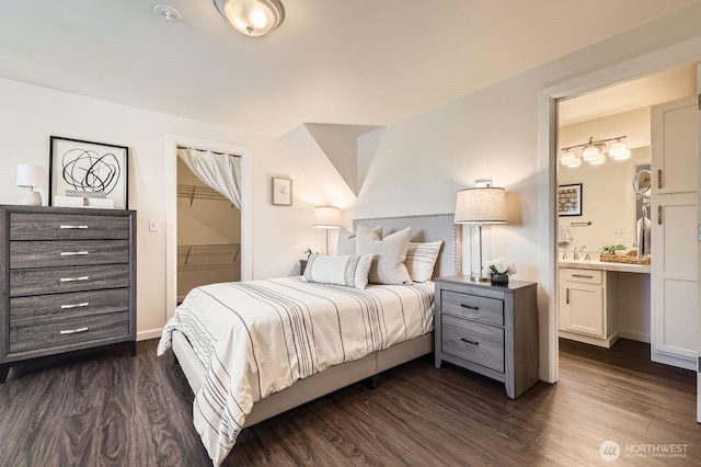 17201 127th Pl NE Unit 101, Woodinville, WA 98072 - bedroom featuring dark wood-style flooring, ensuite bath, a walk in closet, and a closet