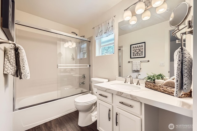 17201 127th Pl NE Unit 101, Woodinville, WA 98072 - full bath featuring vanity, bath / shower combo with glass door, and wood finished floors