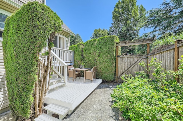 17201 127th Pl NE Unit 101, Woodinville, WA 98072 - view of patio / terrace featuring a wooden deck and a gate